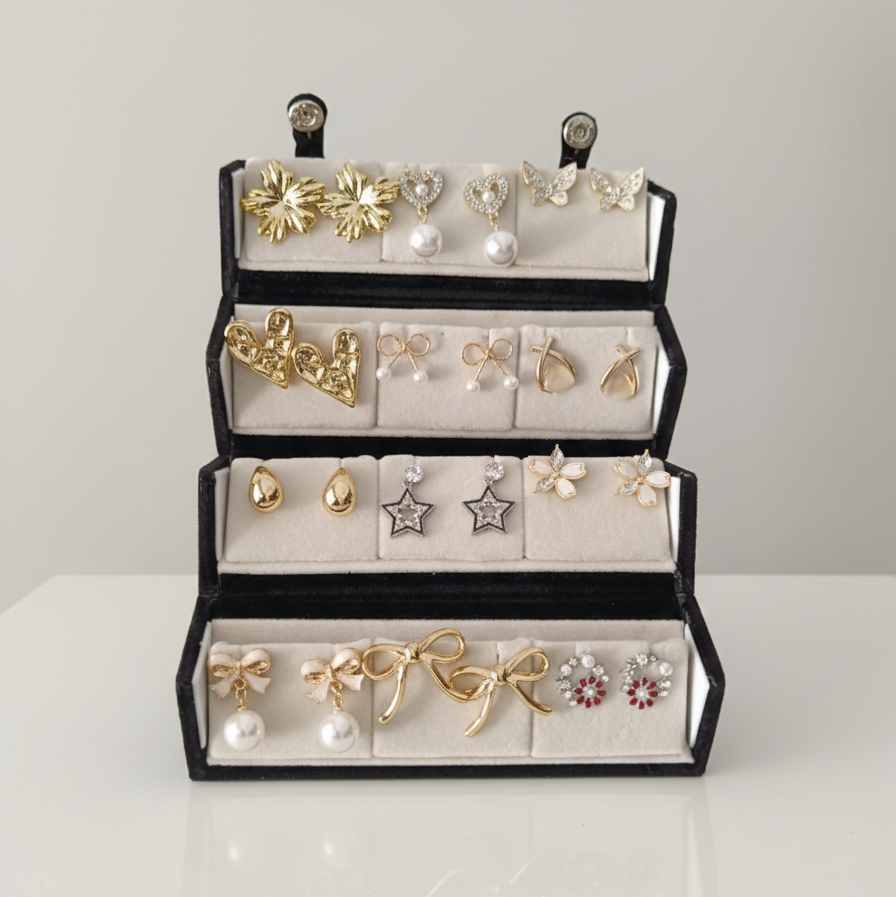 Set of 12 random designer earrings arranged in a premium folding jewellery gift box by ALVINA