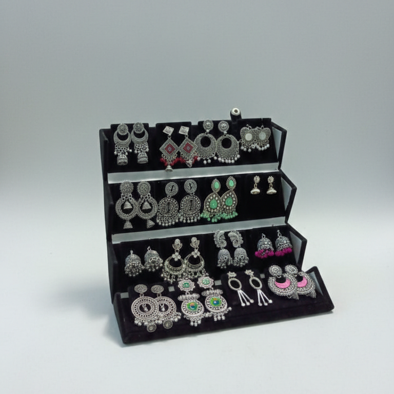 Set of 16 random oxidized earrings arranged in a premium folding jhumka gift box by ALVINA